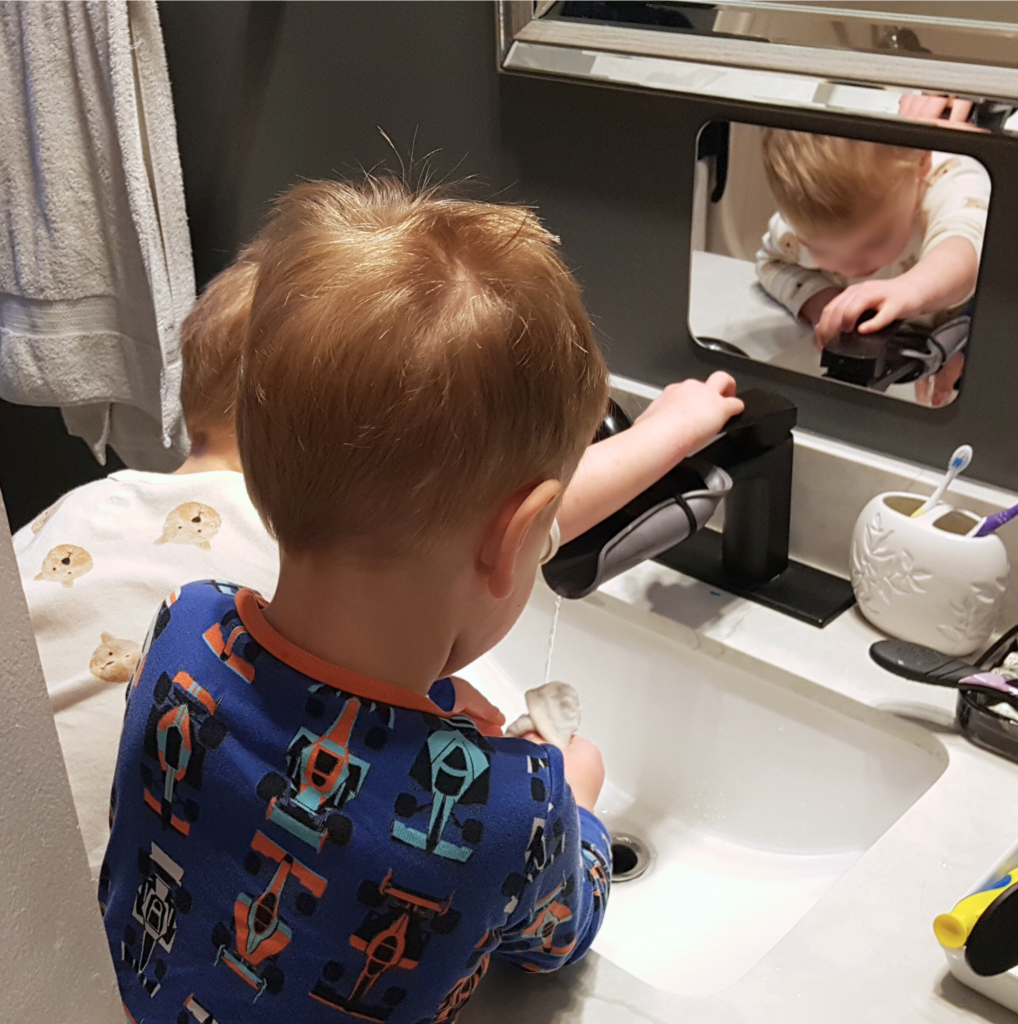 Twins using Montessori Bathroom at Home